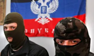 Masked activists with a banner reading 'Donetsk Republic'